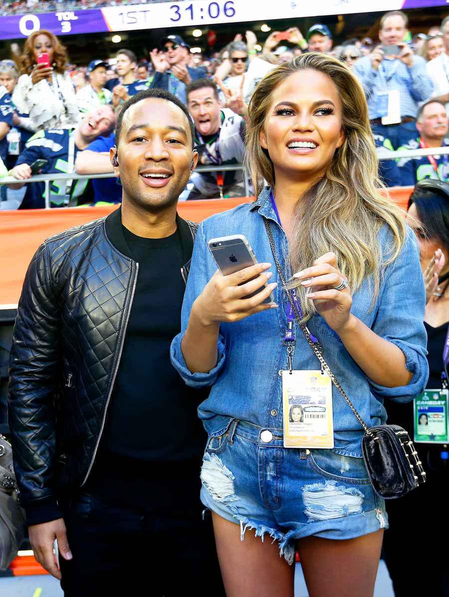 John Legend and Chrissy Teigen during Super Bowl XLIX between the Seattle Seahawks and the New England Patriots at University of Phoenix Stadium on February 1, 2015 in Glendale, Arizona.