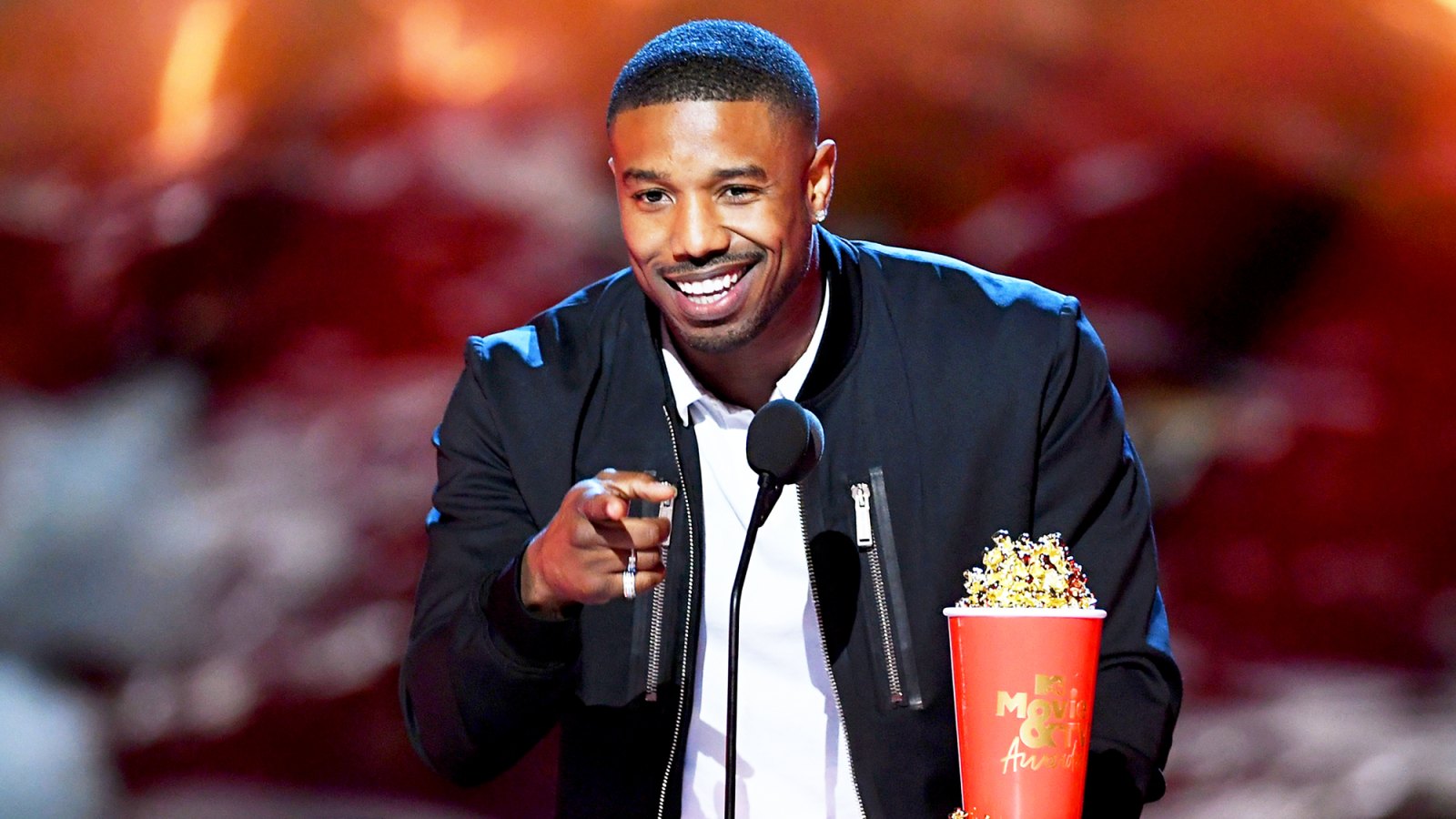 Michael B. Jordan accepts the Best Villain award for 'Black Panther' onstage during the 2018 MTV Movie And TV Awards at Barker Hangar on June 16, 2018 in Santa Monica, California.
