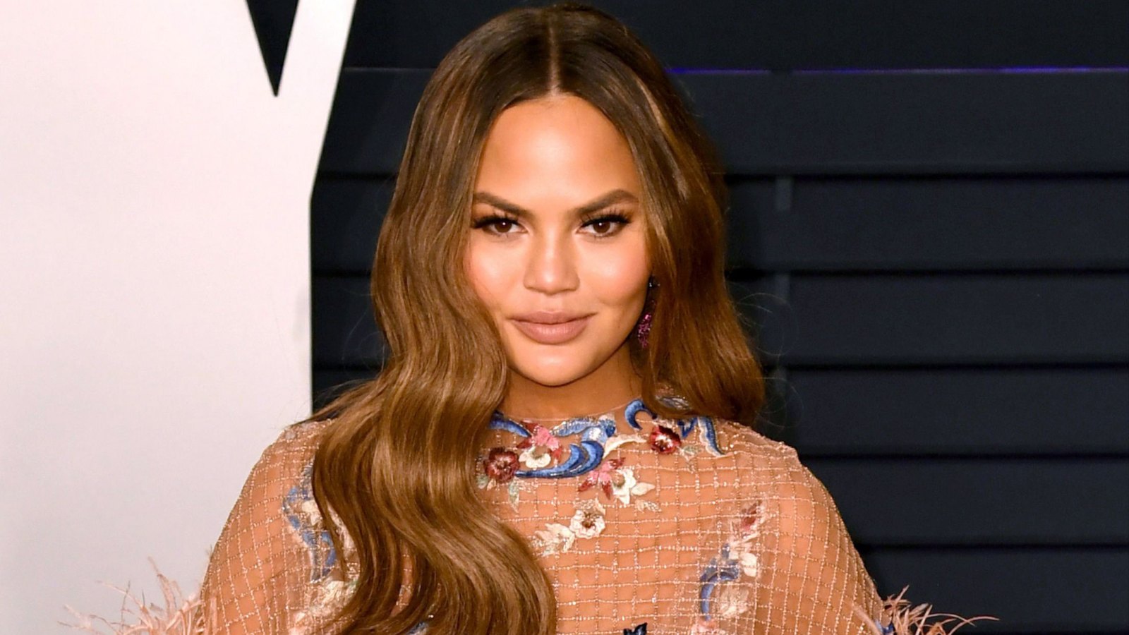 Chrissy Teigen Claps Back at Troll Who Tells Her to 'Cover Up' Around Her Daughter