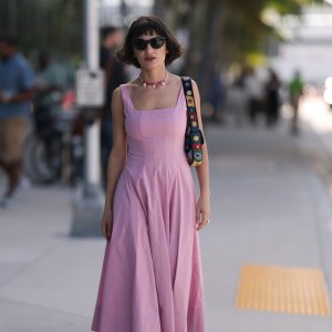 MIAMI, FLORIDA - DECEMBER 02: Fidan Ilham seen wearing a pink pleated longdress with plateau heels and a colourful bag on December 02, 2022 in Miami, Florida. (Photo by Jeremy Moeller/Getty Images)