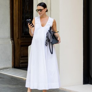 BARCELONA, SPAIN - JUNE 24: Zina Charkoplia wears white wide Dissh dress, Chanel ballerinas, black Hermes bag on June 24, 2025 in Barcelona, Spain. (Photo by Christian Vierig/Getty Images)