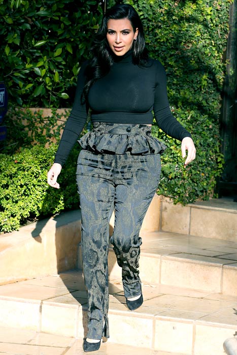 Kim Kardashian Squeezes Pregnancy Curves Into Tight, High-Waisted Peplum  Pants and Crop Top: Picture - Us Weekly