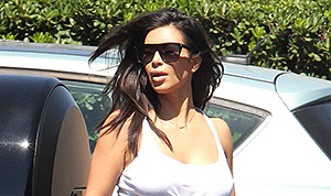 Kim Kardashian covers up in maxi skirt after revealing she is down to  139lbs