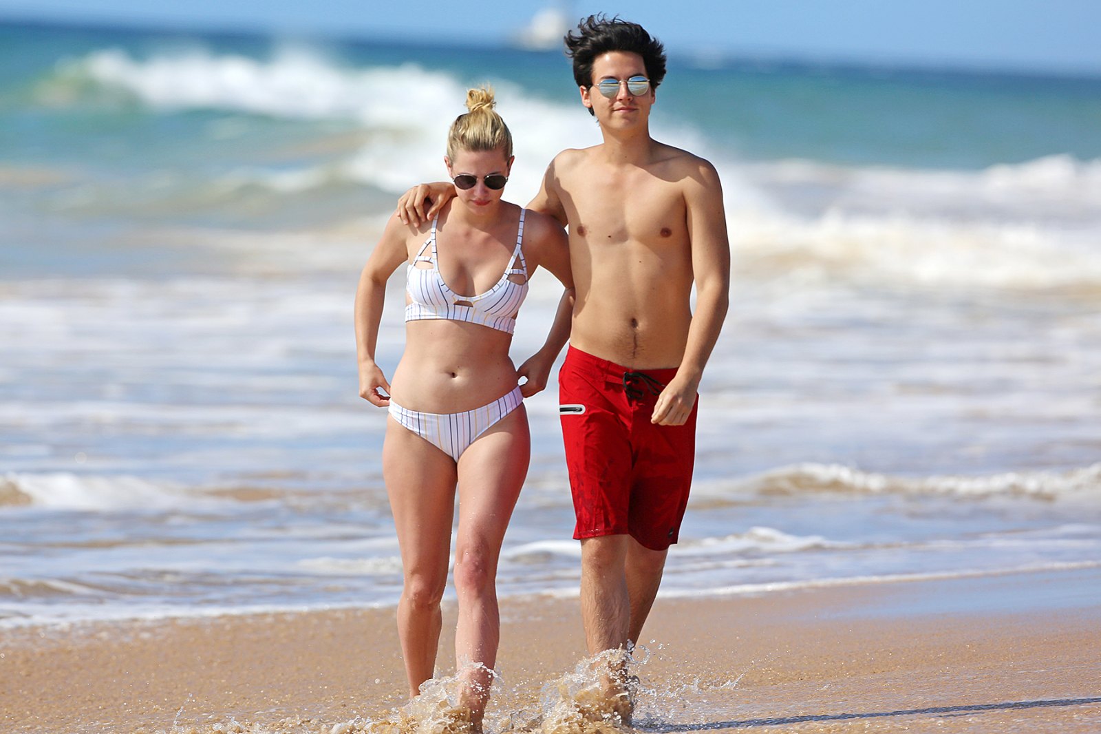 Cole Sprouse Lili Reinhart Get Cozy On The Beach In Hawaii Pics Us Weekly 