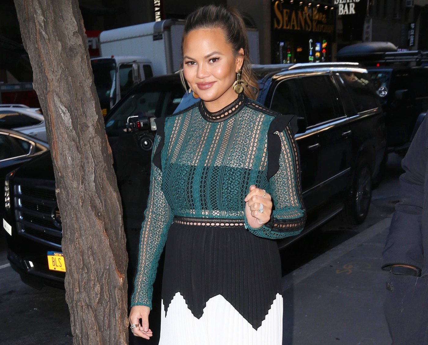 Chrissy Teigen Says Her Unborn Baby Is Sucking The L