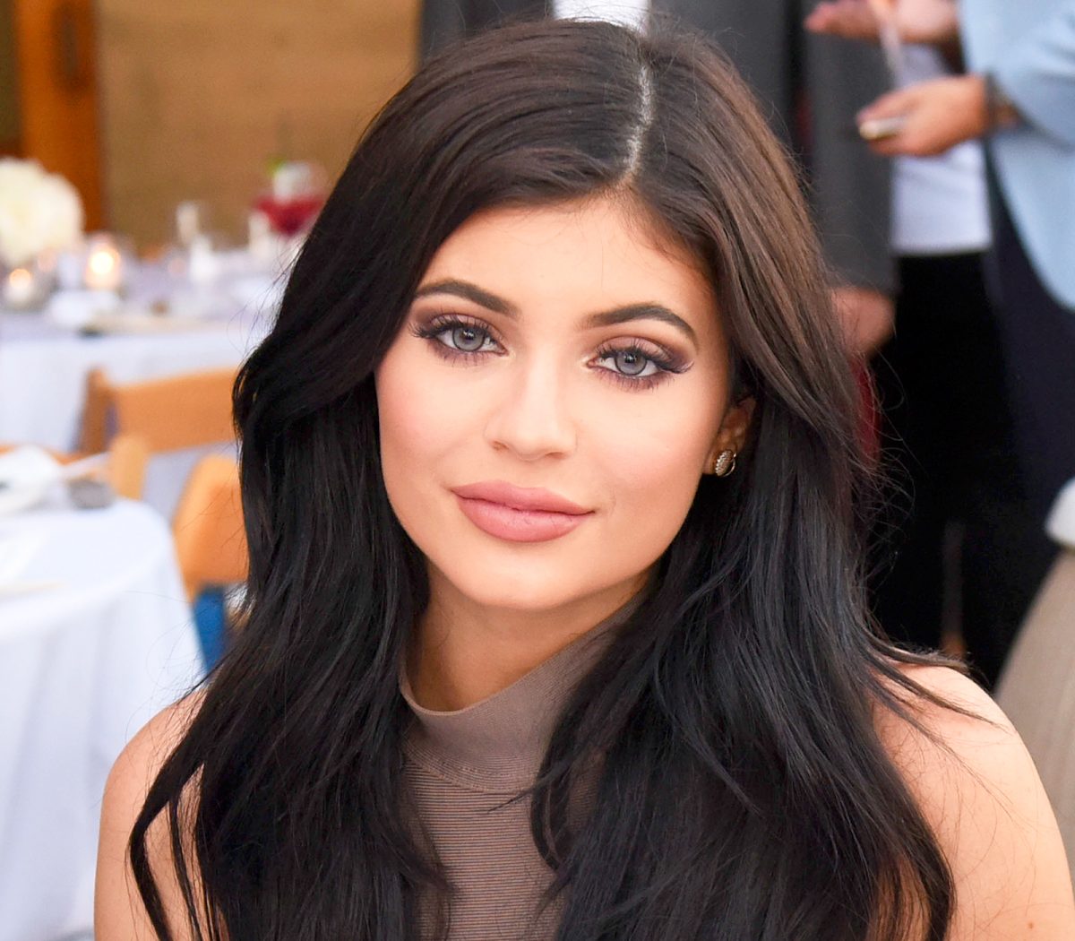 Kylie Jenner looks unrecognizable with new eyebrows as she nearly topples  out of plunging mini dress in new NSFW photo