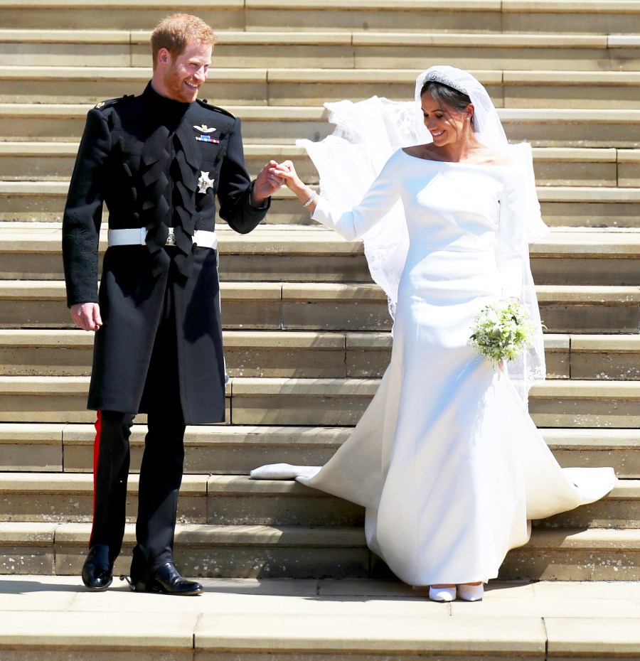 Prince Harry and Meghan Markle emerge from the West Door of St. George's Chapel, Windsor Castle, in Windsor, on May 19, 2018 after their wedding ceremony.