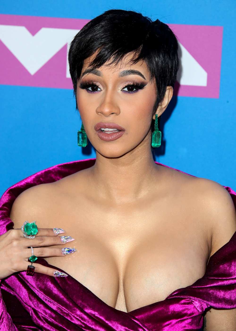 Cardi B reveals she uses duct tape to give her boobs a lift as she arrives  at Paris Fashion Week