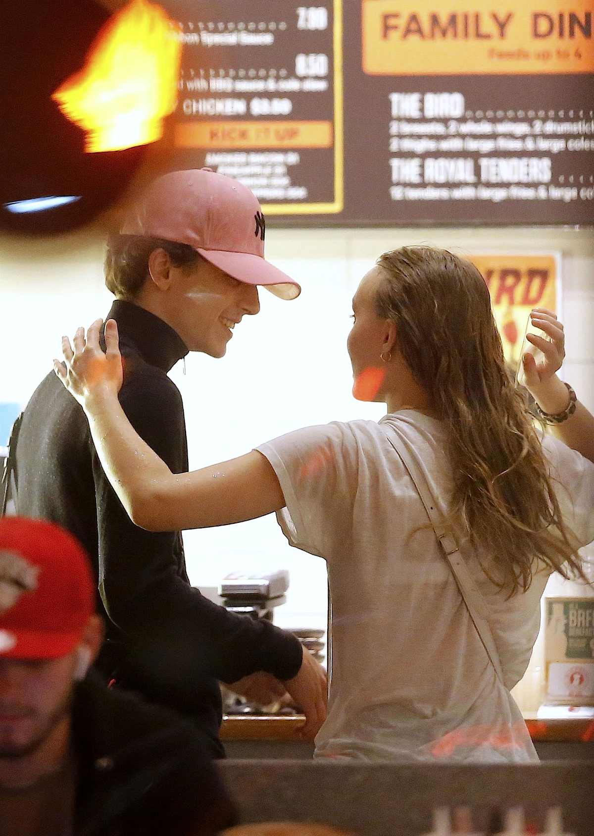 Timothee Chalamet wears a New York Yankees jersey while grabbing a