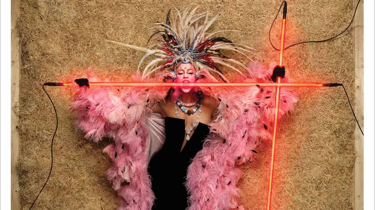 Lady Gaga comes a cropper in Louis Vuitton feather headdress