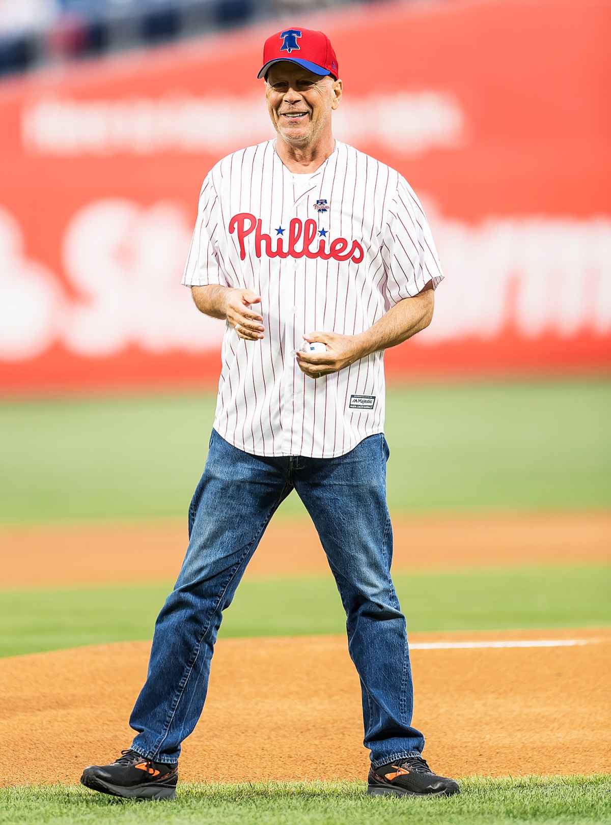 Actor Bruce Willis throws out first pitch, hits batting practice before  Phillies game