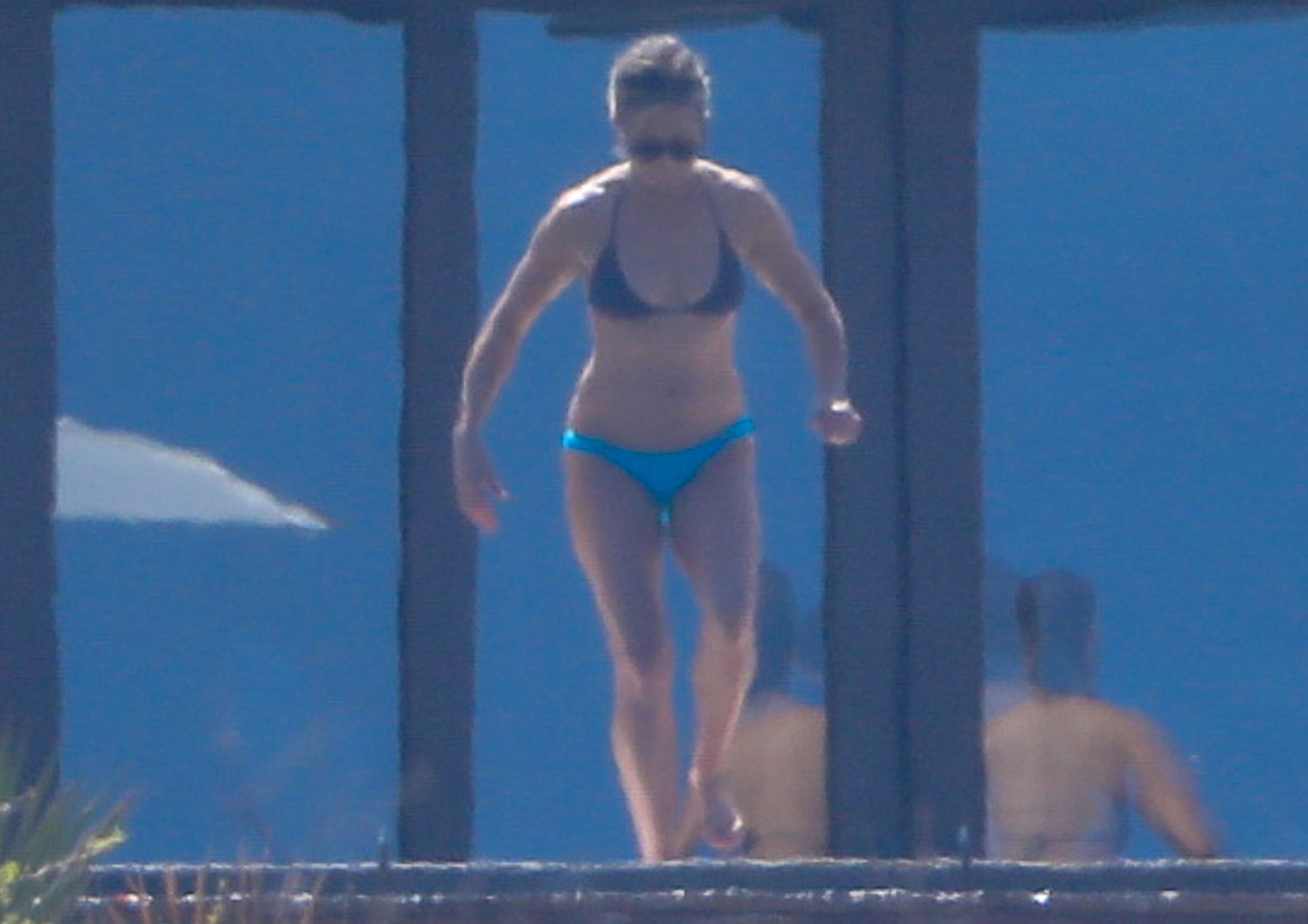 Jennifer Aniston wows in black string bikini as she strides into