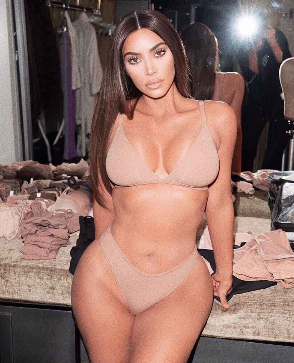 Kim Kardashian poses with NO underwear or bra in see-through