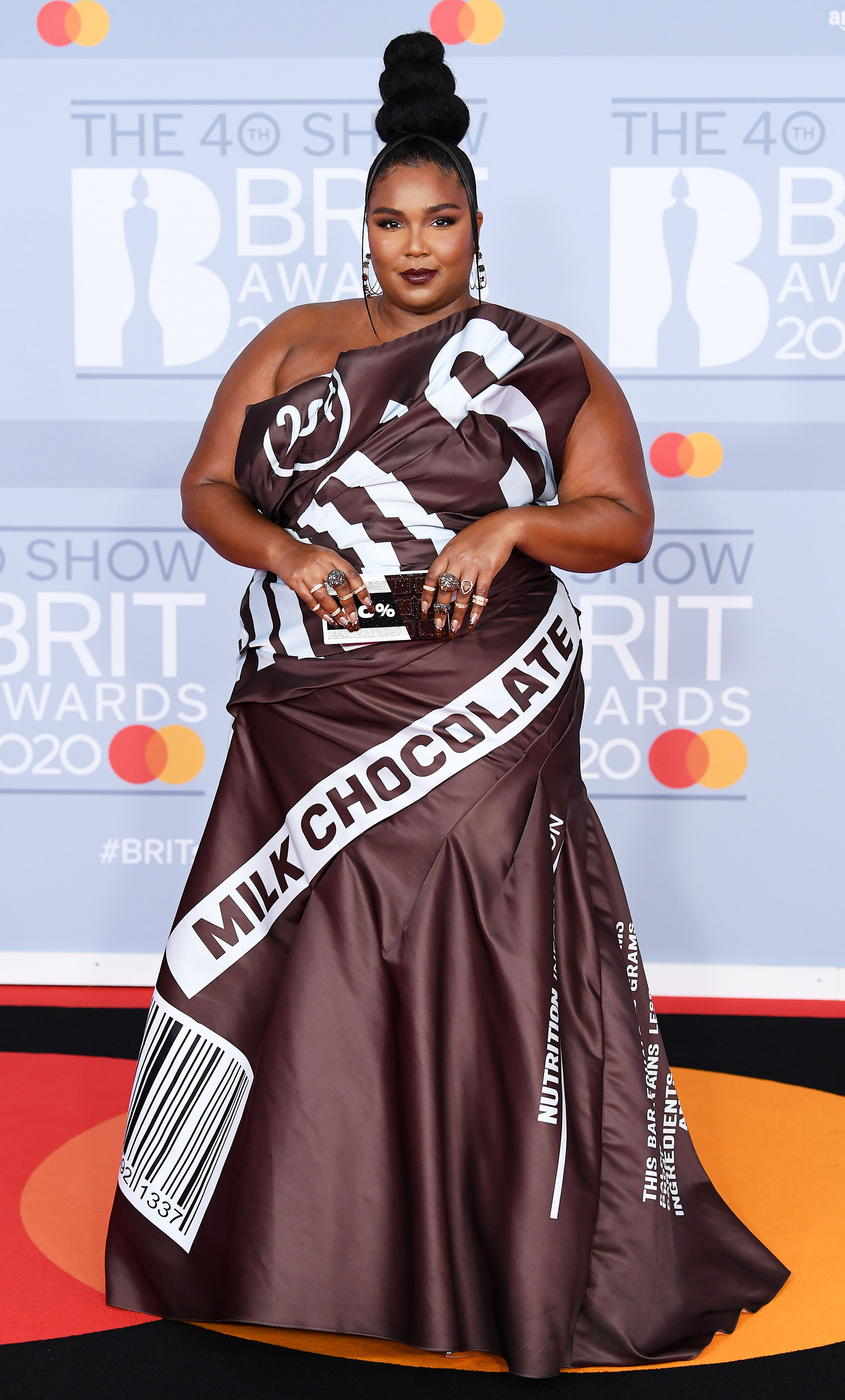 Lizzo Walks the 2020 Brit Awards Red Carpet in a Hershey Bar