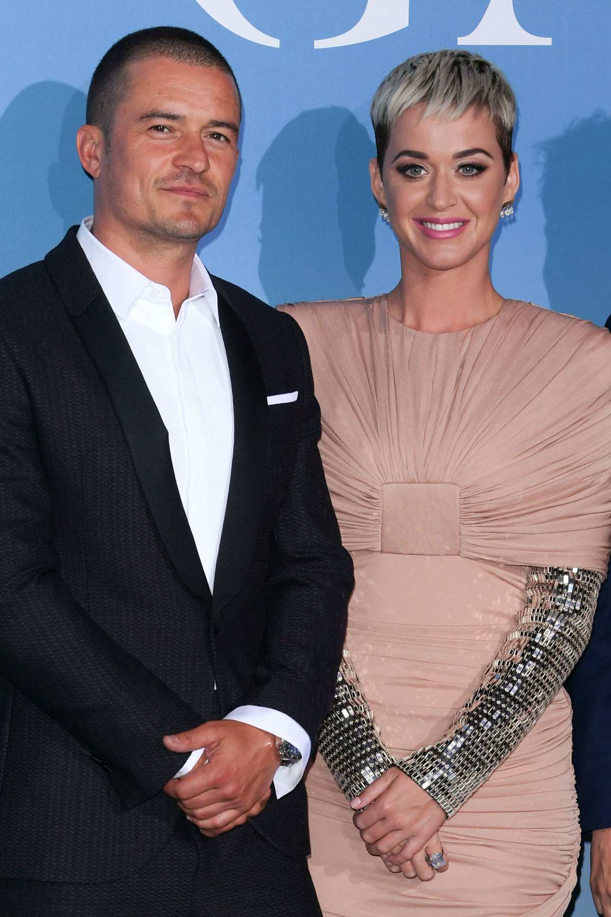 Katy Perry and her fiancé Orlando Bloom's ex-wife Miranda Kerr and are  total style opposites during rare reunion - see photos