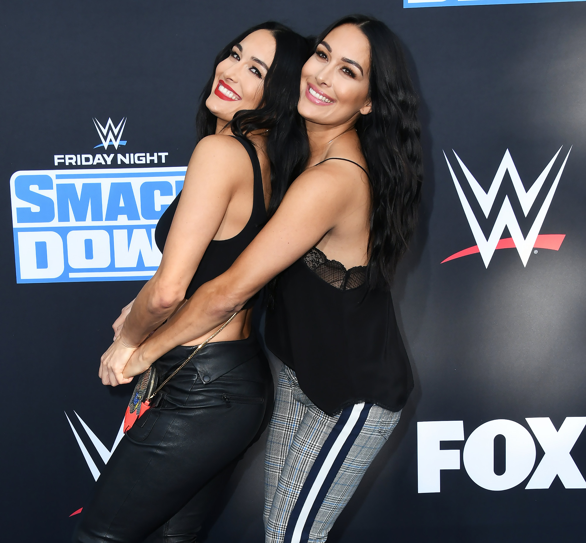 Nikki and Brie Bella take us inside their closets, talk pregnancy style