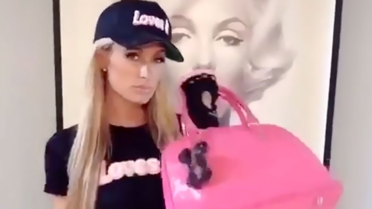 Paris Hilton carrying a Louis Vuitton Agenda