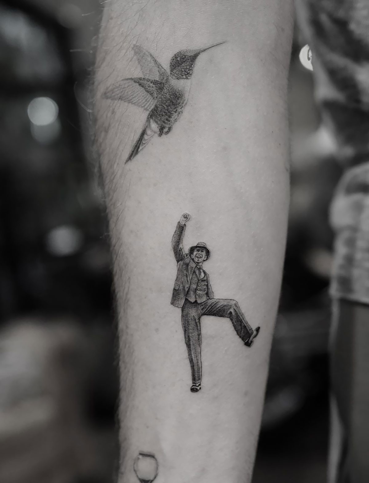 Single needle hummingbird tattoo on Zach Braff