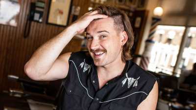 Morgan Wallen poses for a portrait after getting a mullet at Paul Mole Barber Shop Who Is Morgan Wallen 5 Things to Know About the Scandal-Ridden Country Singer