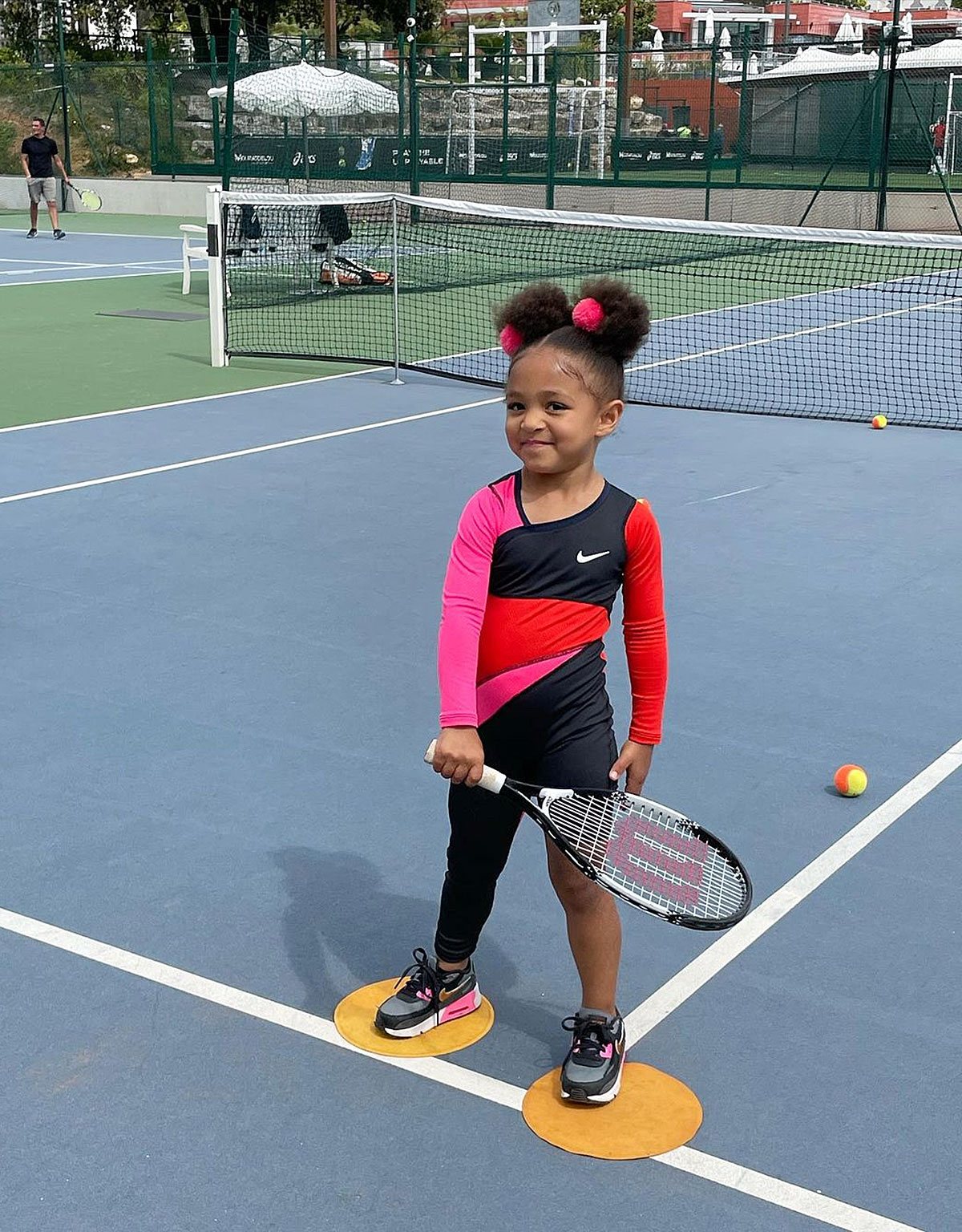 Serena Williams' daughter Olympia practices tennis while her dad