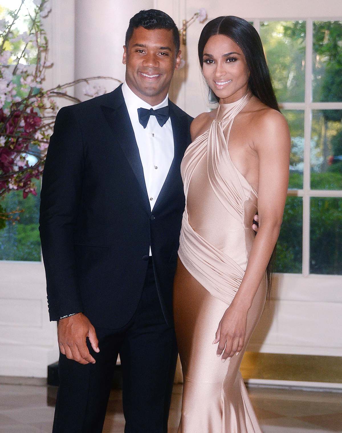 Russell Wilson and Ciara during a women's singles match at the