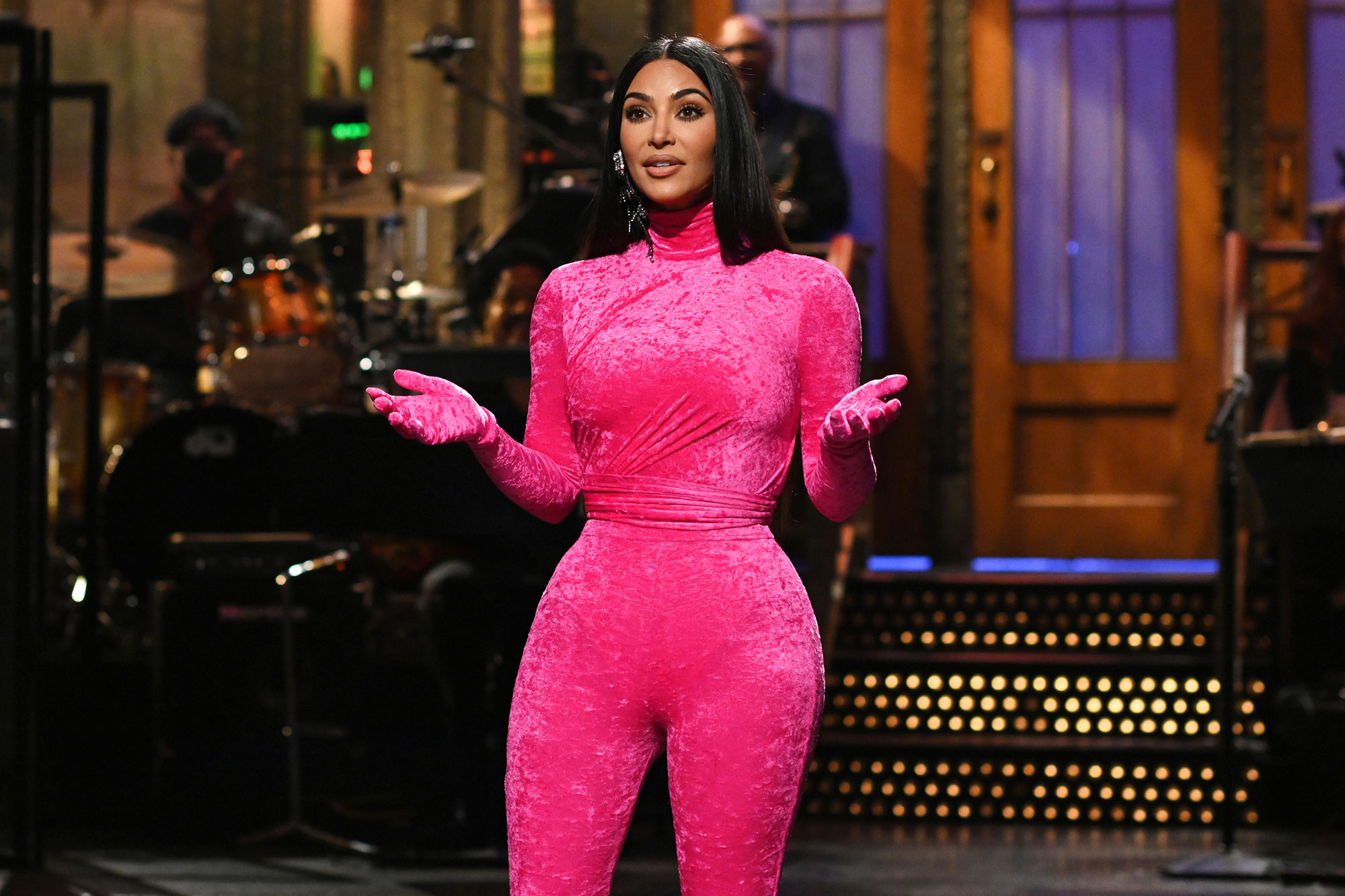 Kim Kardashian wears an outfit that shows off her figure as she