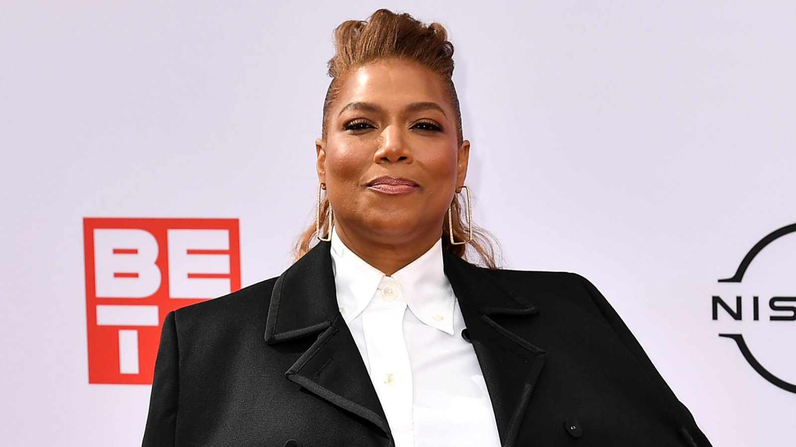 https://www.usmagazine.com/wp-content/uploads/2021/10/Queen-Latifah-Was-Asked-to-Lose-Weight-for-Living-Single-Role.jpg?crop=0px%2C0px%2C1512px%2C854px&resize=1600%2C900&quality=86&strip=all