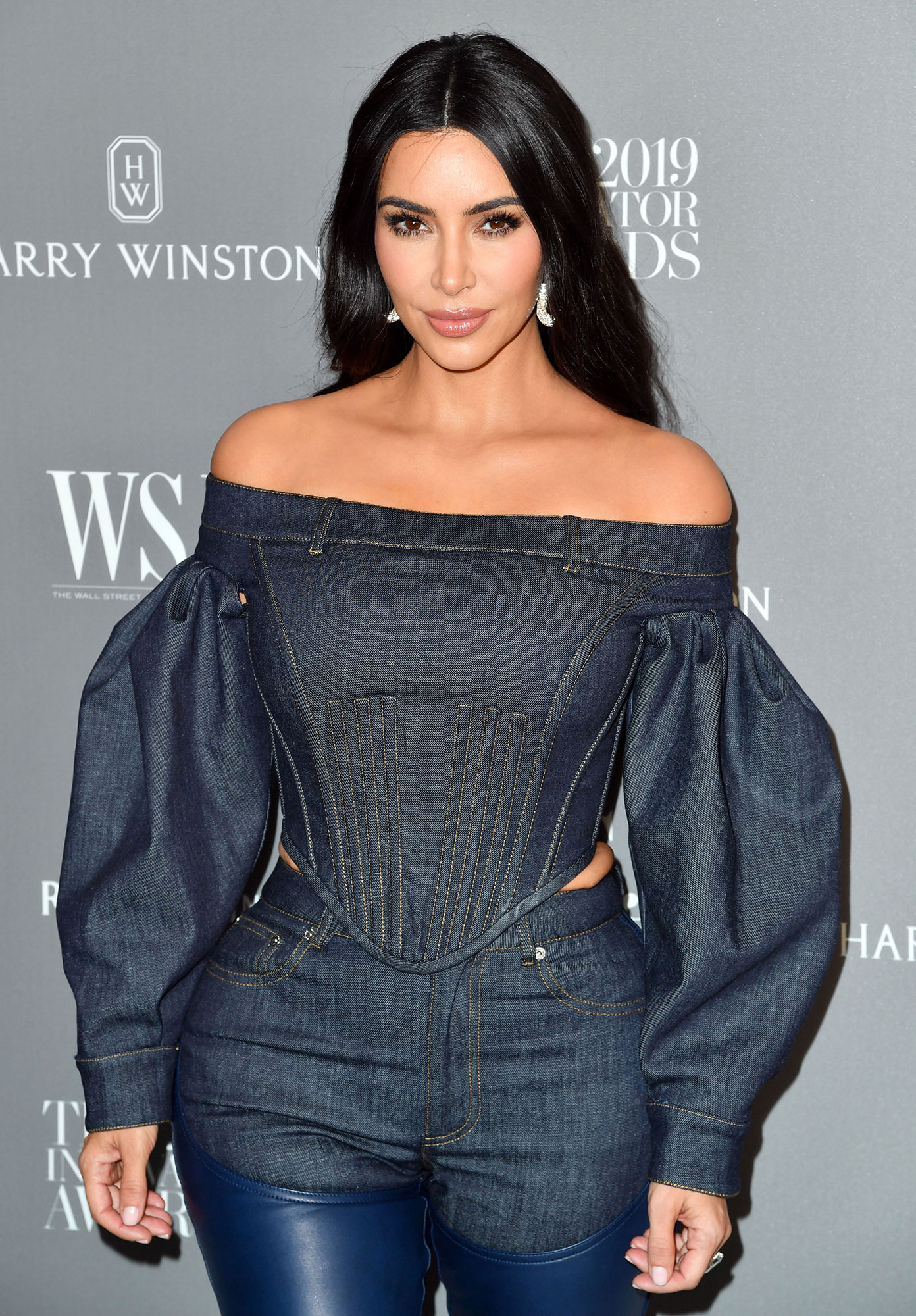 Kim Kardashian Shows Off Black Bodysuite & Heels In New SKIMS Pic