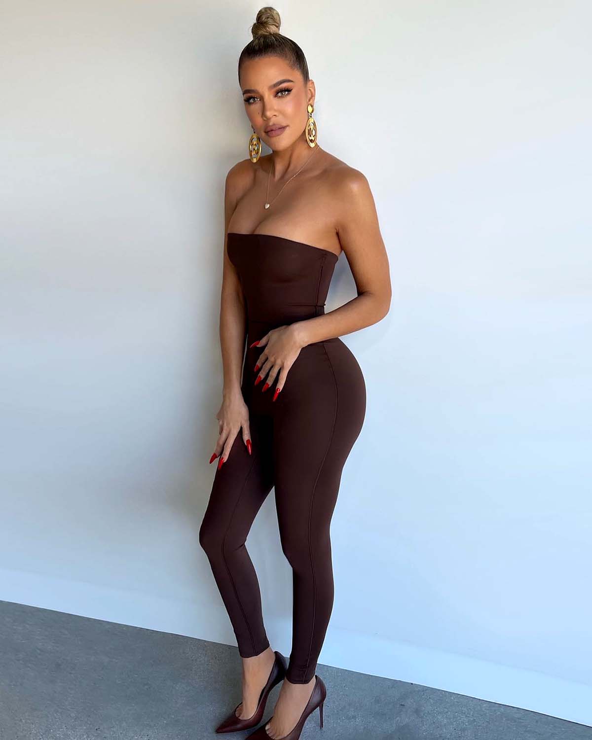 Kylie Jenner shows off her curves in a tight catsuit with her