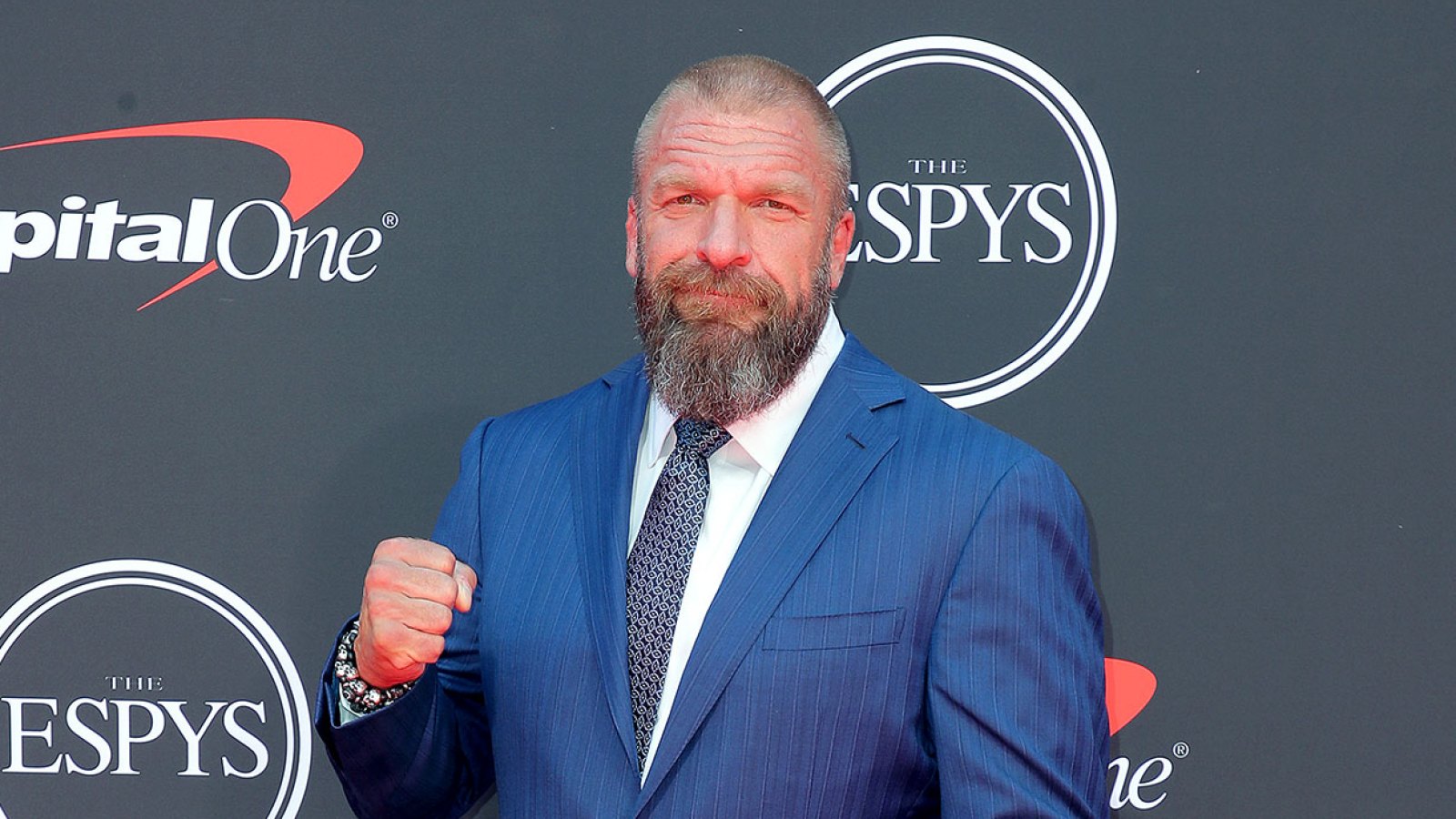 WWE legend Triple H, 52, retires from wrestling after having defibrillator  fitted into chest after heart surgery