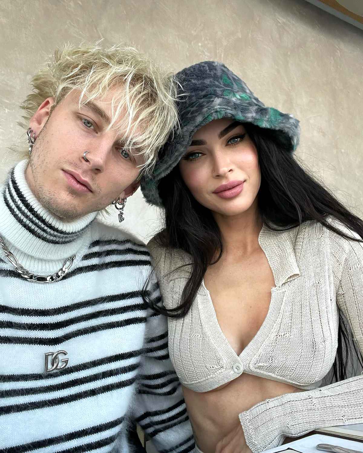 Megan Fox cheers on fiance Machine Gun Kelly as he plays during