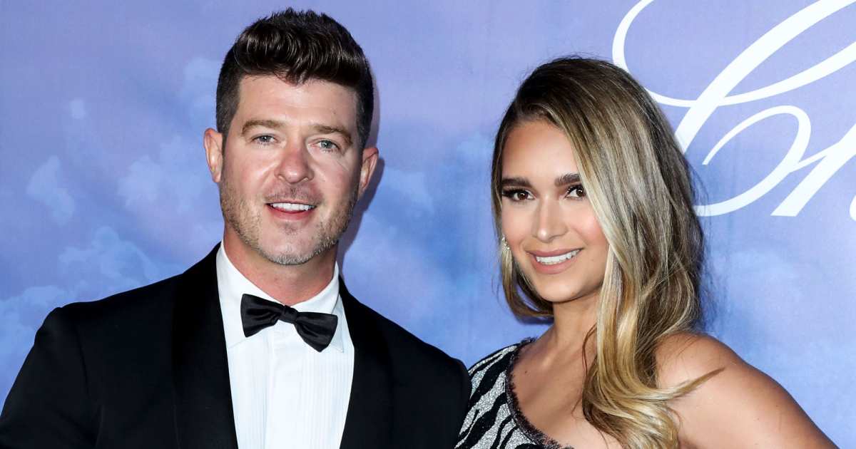 Robin Thicke posts pic of wife's near nip slip days after