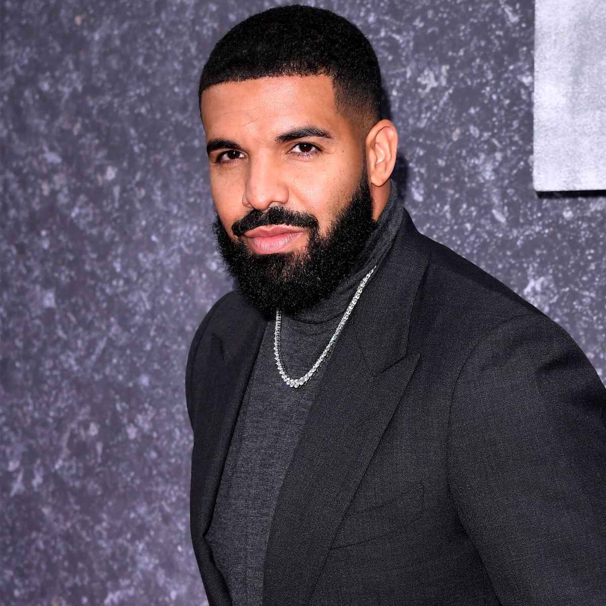 drake-gets-mom-sandra-graham-s-initials-tatted-on-his-face-pic-us-weekly