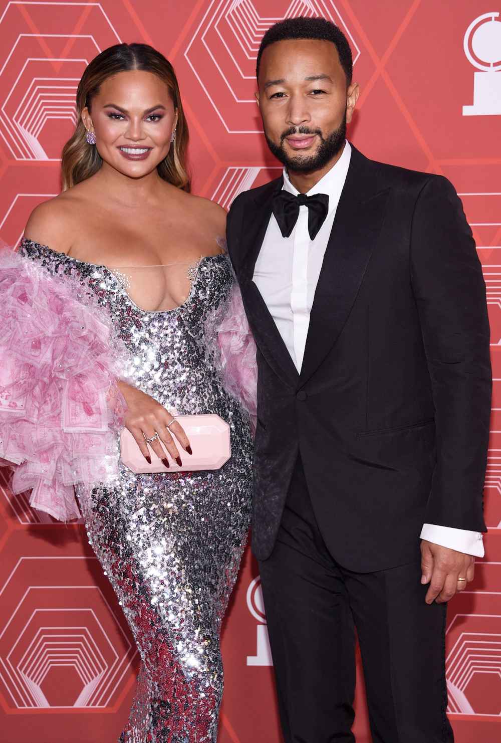 Pregnant Chrissy Teigen Crashes John Legend’s Zoom Interview to Show Off Her Growing Baby Bump: Watch