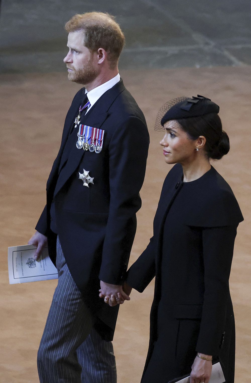 Prince Harry and Meghan Markle Hold Hands As They Exit Queen Elizabeth II’s Westminster Hall Service