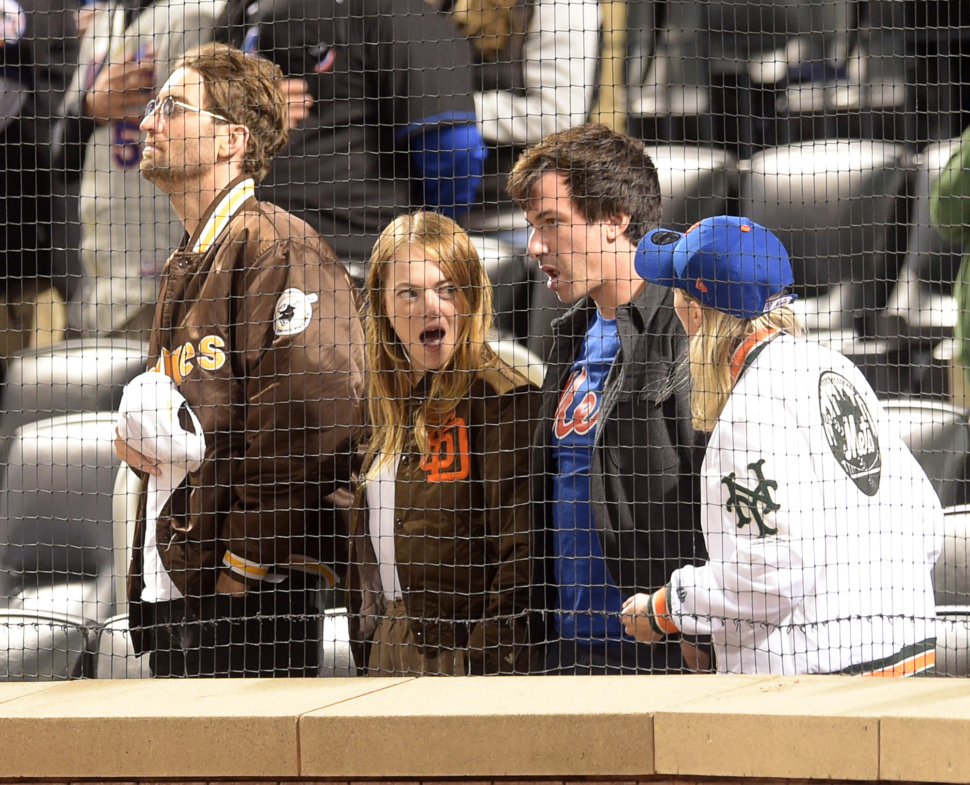 Emma Stone, husband Dave McCary pose for photos at Padres game