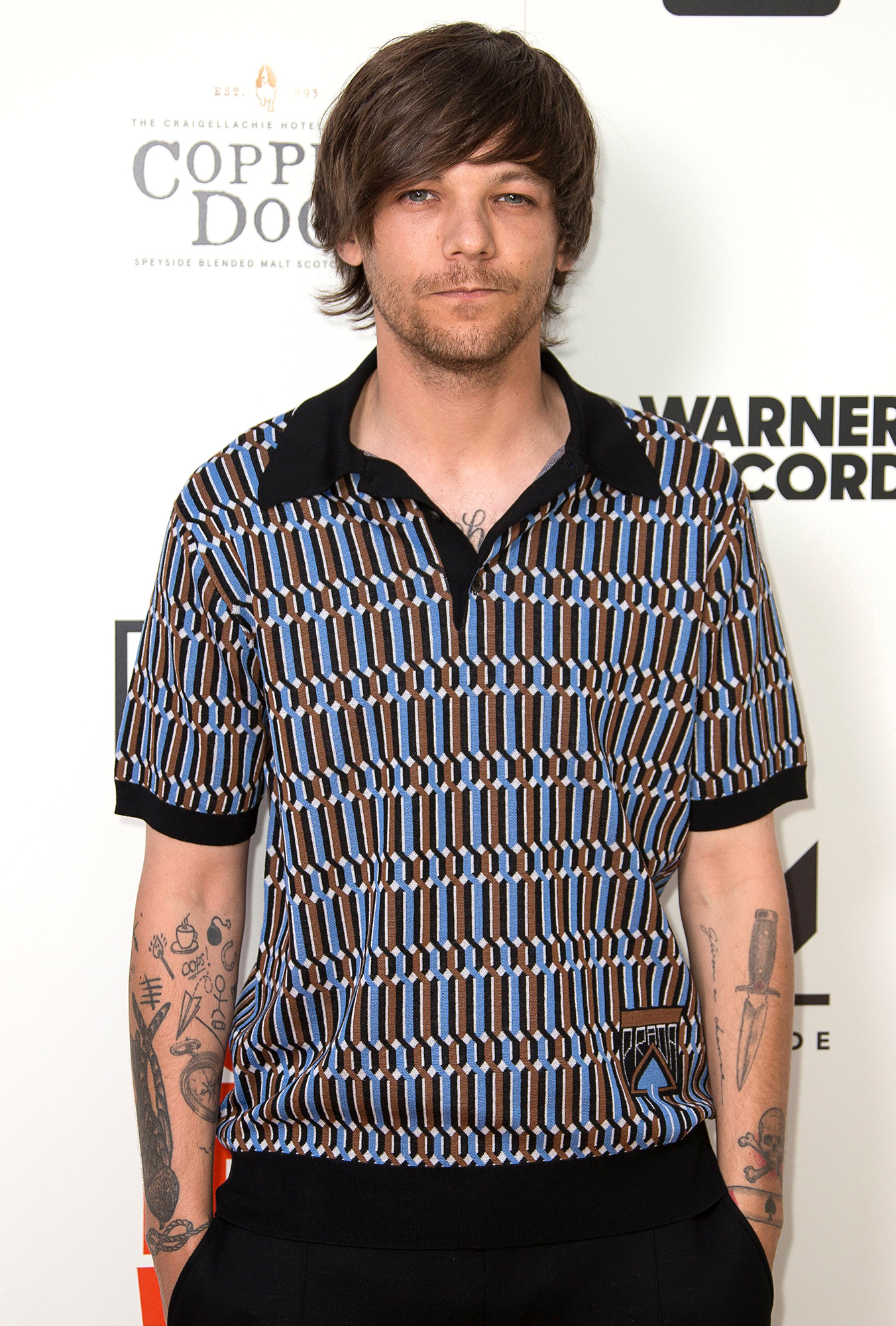 Louis Tomlinson steps out for the first time wearing hospital bracelet  following birth of baby son - OK! Magazine