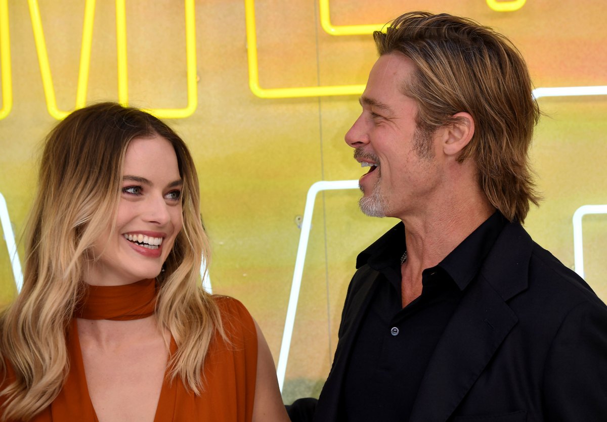 Margot Robbie Reveals She Improvised A Scene To Kiss Brad Pitt Us Weekly