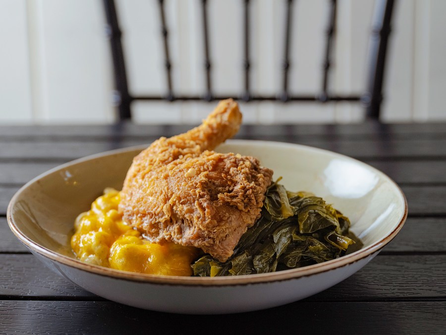 Chef Judy Joo Talks to Melba Wilson About Soul Food, Dream Dinner Guests and More- See Melba's Country Collard Greens Recipe -585 Sourth Fried Chicken with Tres Mac & Cheese and Low Country Collard Greens photographed at Melba's Restaurant in the Harlem neighborhood of New York City. \