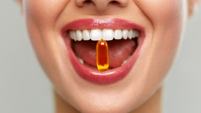 Woman-Taking-Vitamin-Closeup-Shot-Stock-Photo