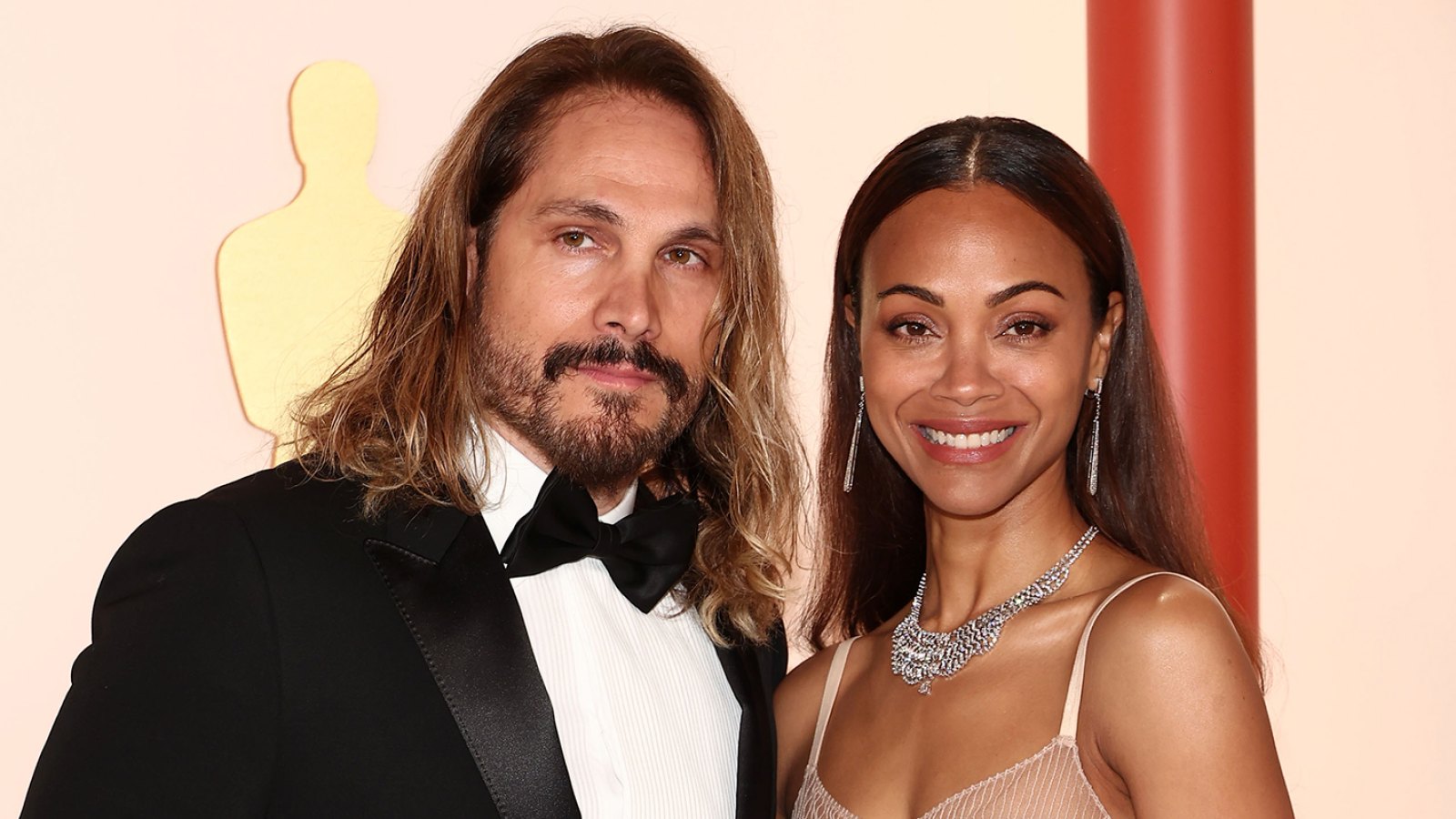 https://www.usmagazine.com/wp-content/uploads/2023/06/Zoe-Saldana-Poses-Topless-Shows-Rare-Glimpse-of-Her-Tattoo-of-Husband-Marco-Peregos-Face-Inline-01.jpg?crop=64px%2C23px%2C1416px%2C801px&resize=1600%2C900&quality=86&strip=all
