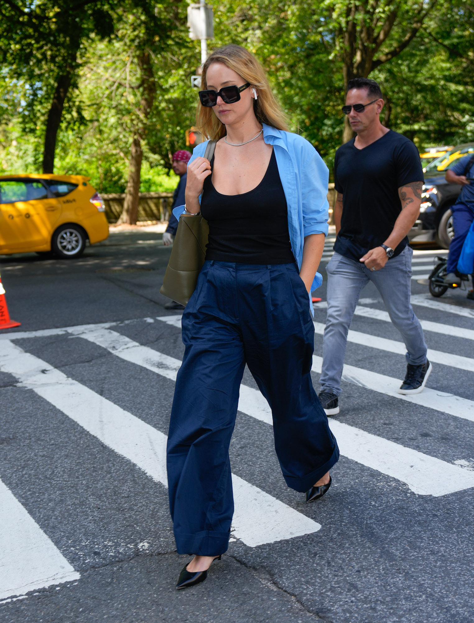 Jennifer Lawrence looks good in a knit sweater and blue trousers while  visiting a doctor's office in New York City