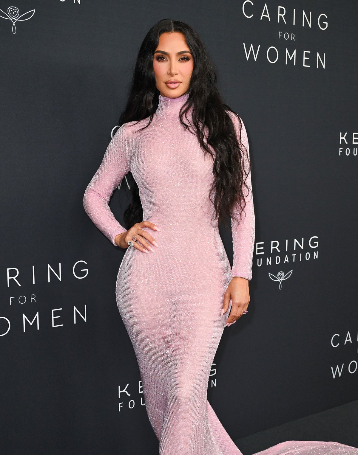 Kim Kardashian wears an outfit that shows off her figure as she