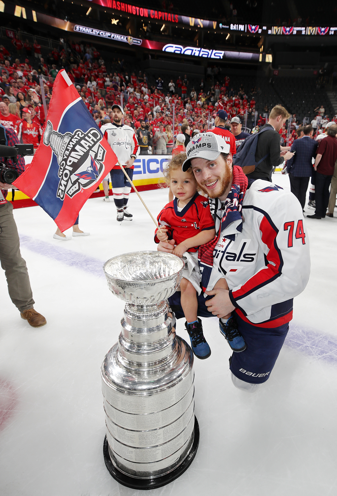 A family poses with their baby in the Stanley Cup during its visit to  News Photo - Getty Images