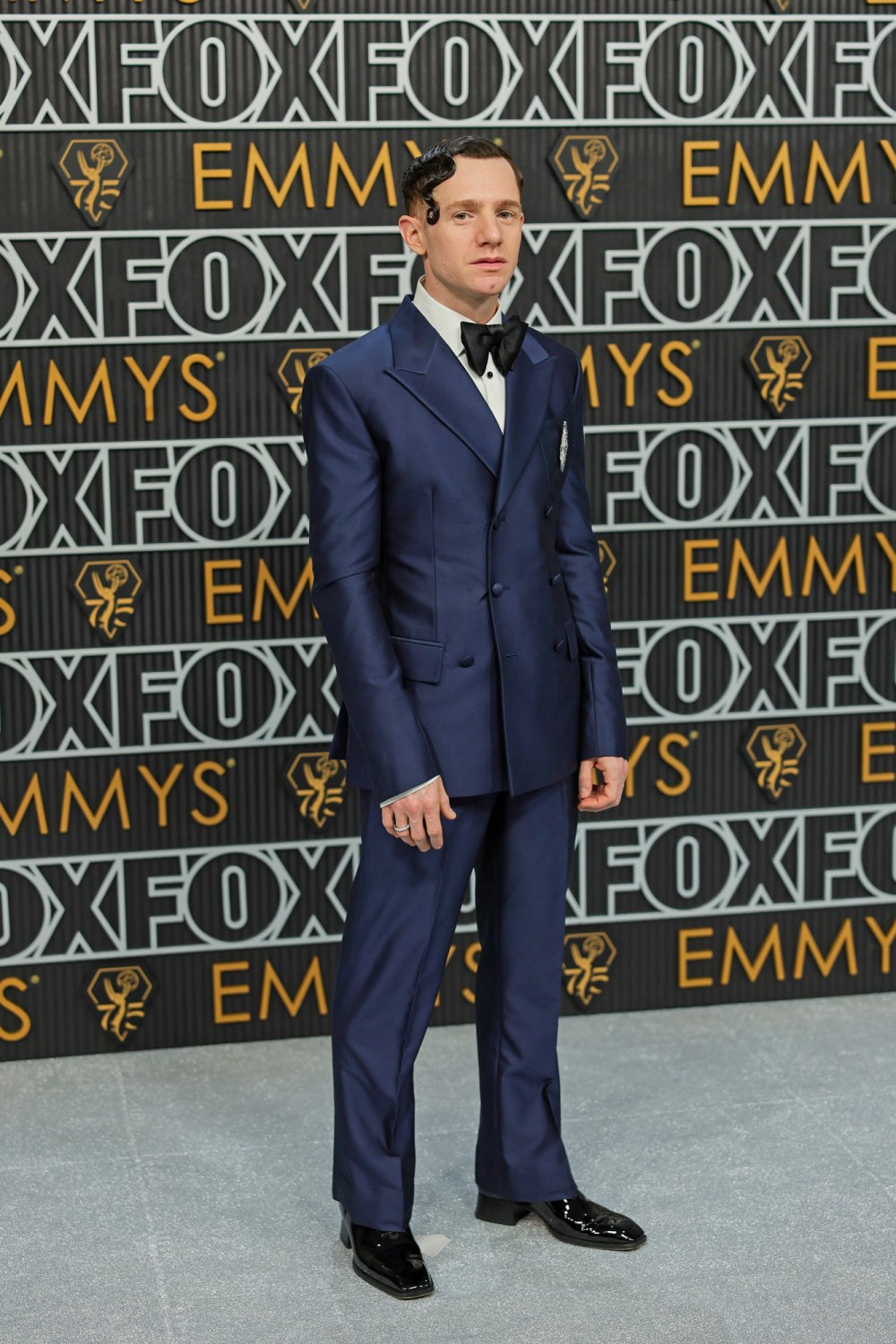 Chris Perfetti Sports Artfully Gelled Hair and a Sharp Navy Suit at the 2023 Emmys