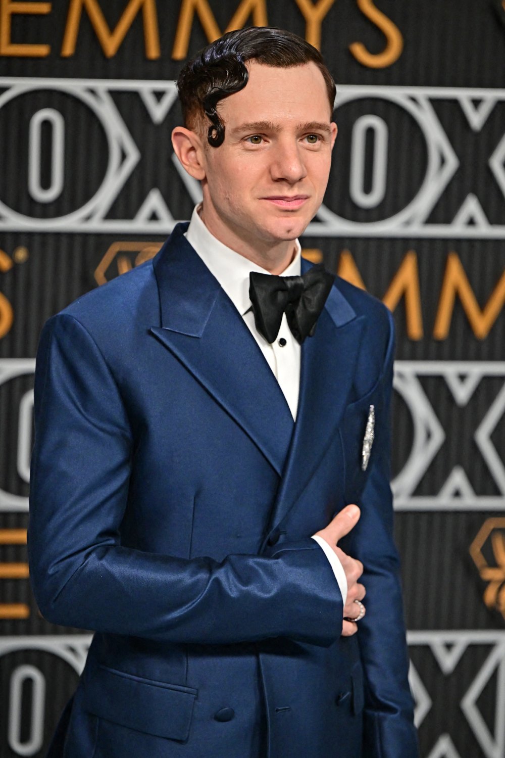 Chris Perfetti Sports Artfully Gelled Hair and a Sharp Navy Suit at the 2023 Emmys