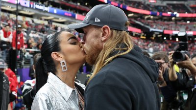 49ers George Kittle and his wife Claire kiss before the 2024 Super Bowl