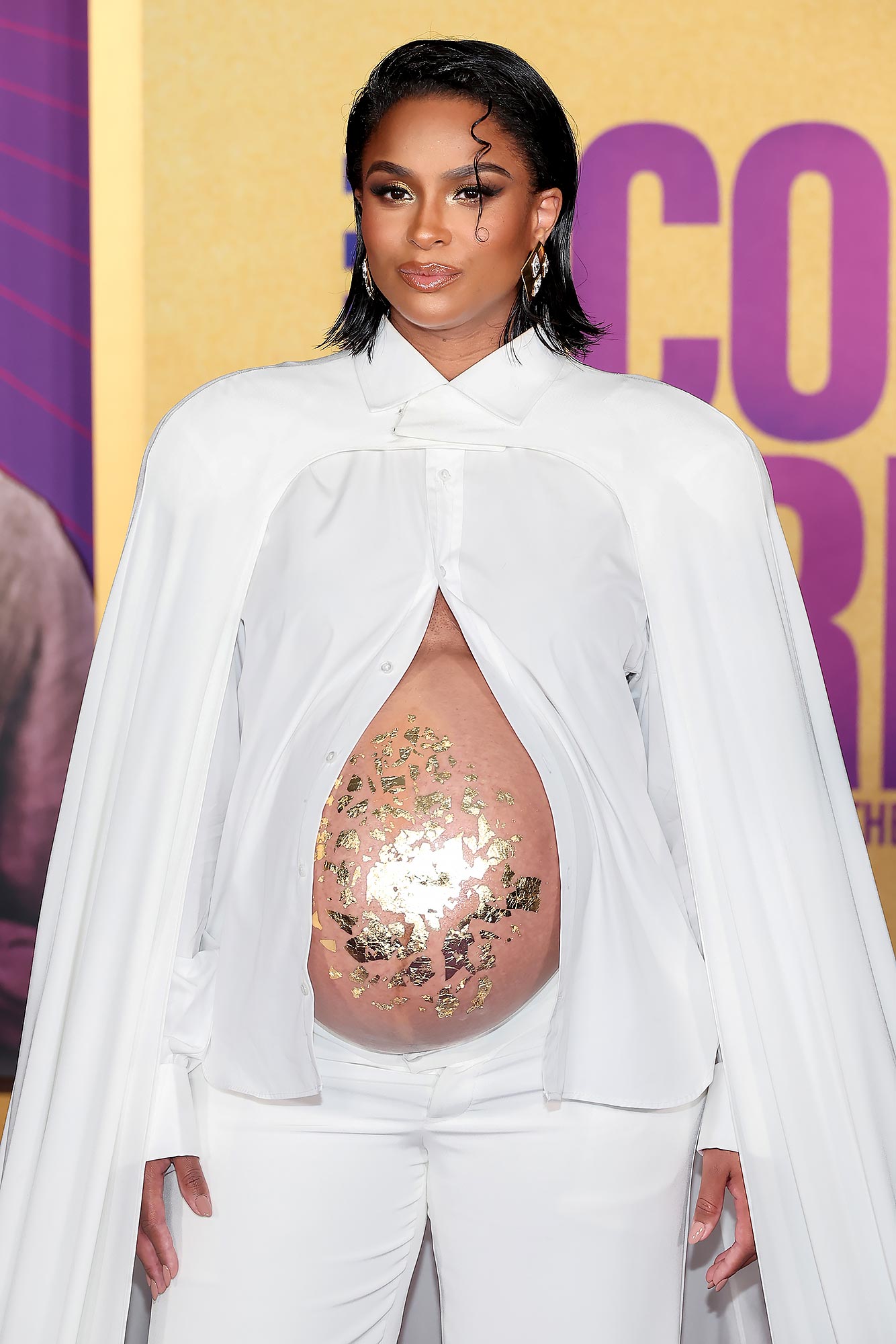 Pregnant Ciara channels Rihanna's sexy maternity style with bump-baring  crop top, low-rise jeans