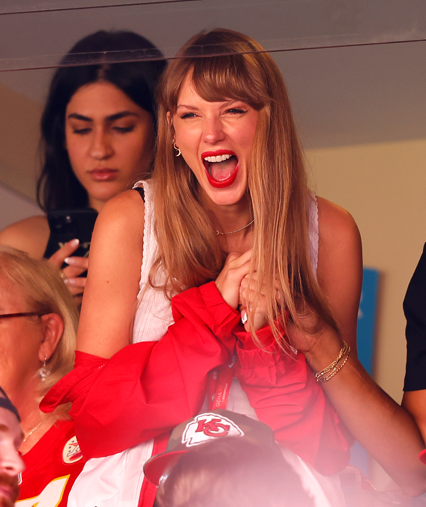 Taylor Swift and Brittany Mahomes Root for Their Guys in Matching Custom  Coats at Chiefs-Dolphins Game