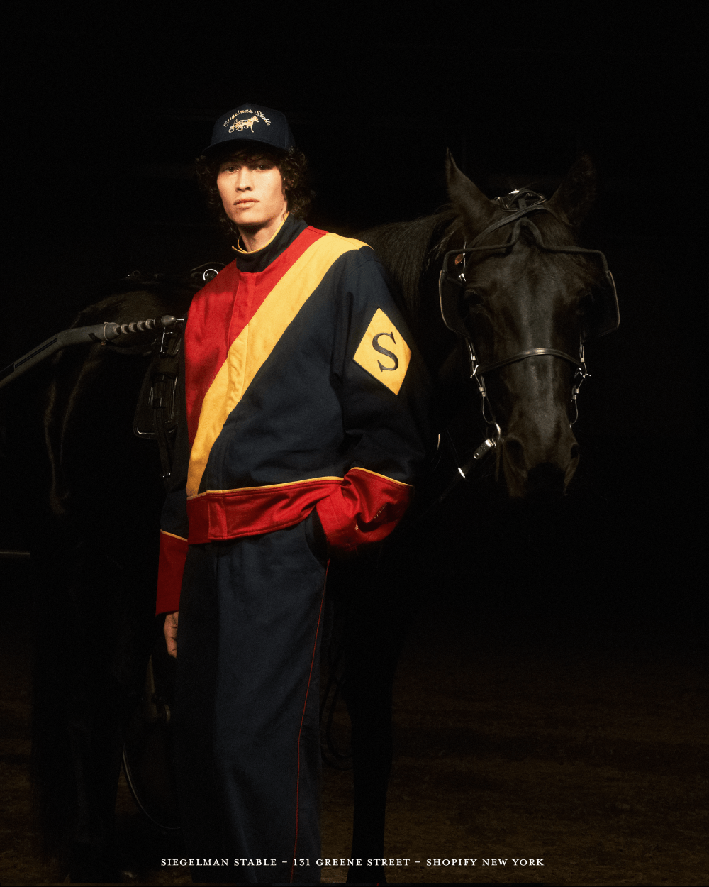 Man in Siegelman Stable tracksuit with horse